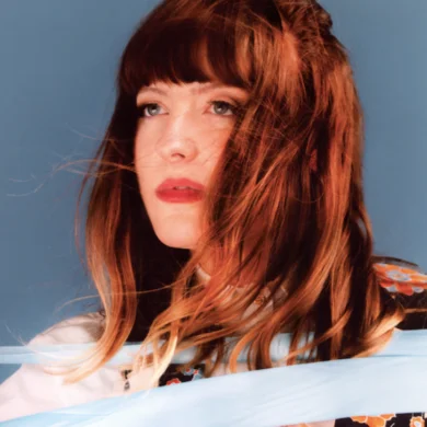 Molly Burch looking off to the left from the POV of the camera