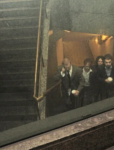 The four members of the band Lip Critic walking up the stairs
