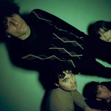 The four members of the band slate