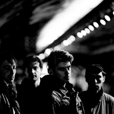 Black and white image of four members of the band Egyptian Blue