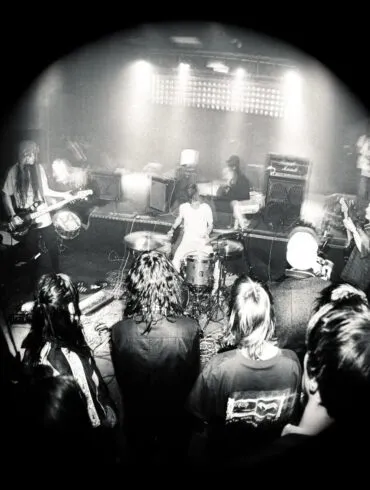 Black and white photo of the band university on stage