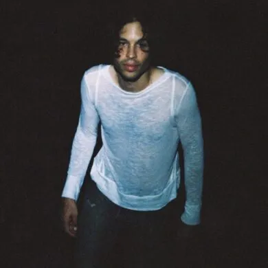 The singer Body Meat in colour looking up at the camera