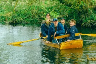 The five members of the band Eades in a canoe