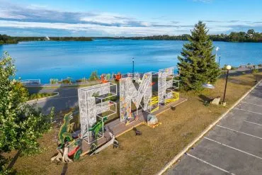 FESTIVAL REPORT: Festival De Musique Émergente (FME) 33 FME sign against lake.