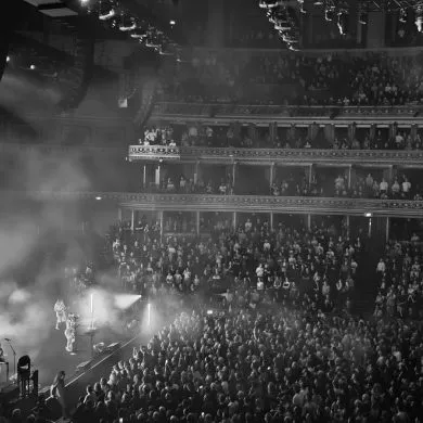 Wet Leg Live at the Royal Albert Hall, wiide shot of the stage and crowd in black and white.